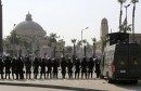 Riot police officers take positions in front of Cairo University