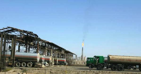 Oil trucks queue at the Iraqi Northern Oil Refinery near the town of Baiji, 10 November 2007. Iraq's Kurdish region has defiantly signed seven new foreign oil deals in a move sure to anger Baghdad, which opposes the unilateral sell-off of crude blocks in the absence of a national oil law, whilst world oil prices drifted closer to 100 dollars a barrel. AFP PHOTO/PATRICK BAZ (Photo credit should read PATRICK BAZ/AFP/Getty Images)
