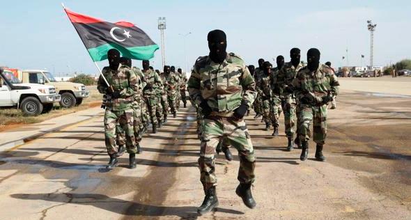 Libyan Army soldiers march during a military graduation parade for trainees in Tripoli November 12, 2014. The trainees will provide security for Tripoli's air base. REUTERS/Ismail Zitouny (LIBYA - Tags: POLITICS MILITARY)