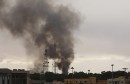 Black smoke billows in the sky above areas where clashes are taking place between pro-government forces, who are backed by the locals, and the Shura Council of Libyan Revolutionaries, an alliance of former anti-Gaddafi rebels, who have joined forces with t