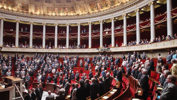 Members of French parliament observe a m