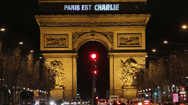 The message "Paris is Charlie" is projected on the Arc de Triomphe in Paris
