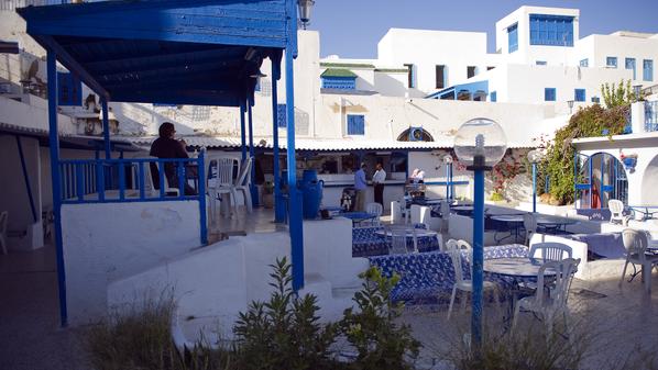 Tourists sit in a cafe of Sidi Bou Said