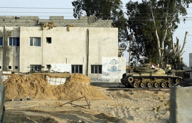 An Egyptian army tank is seen stationed outside a school taken over by soldiers in the Sinai Peninsula