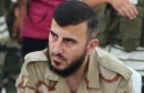 Zahran Alloush, commander of Jaysh al Islam, sits during a conference in the town of Douma, eastern Ghouta in Damascus