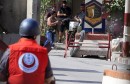 A Fatah fighter shoots his weapon during clashes with Islamists in Ain al-Hilweh Palestinian refugee camp, near the port-city of Sidon