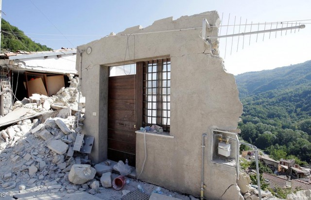A front door of a collapsed house is seen following an earthquake in Pescara del Tronto