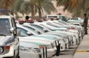 Saudi police cars are parked and policem