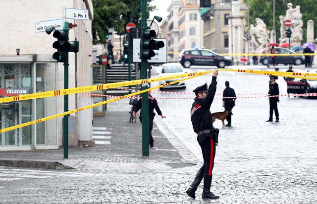 Carabinieri's officers patrol the area after a bomb alert in a bank on the road leading to the Vatican in Rome