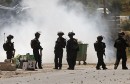 Israeli policemen take position during clashes with Palestinians at a protest in support of Palestinian prisoners on hunger strike in Israeli jails, in the West Bank village of Beita, near Nablus