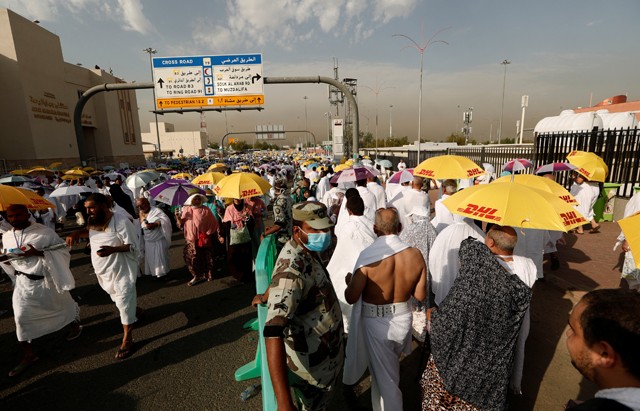 Muslim pilgrims gather on Mount Mercy on the plains of Arafat during the annual haj pilgrimage, outside the holy city of Mecca