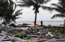 A man stands among ruins after a tsunami hit at Carita beach in Pandeglang, Banten province