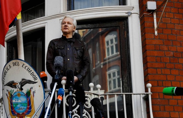FILE PHOTO: FILE PHOTO: WikiLeaks founder Julian Assange is seen on the balcony of the Ecuadorian Embassy in London