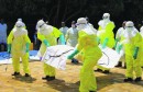 FILE PHOTO: Congolese officials and the World Health Organization officials wear protective suits as they participate in a training against the Ebola virus near the town of Beni
